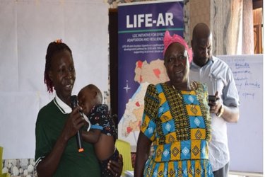 District representatitives during community mobilisation activities in Uganda