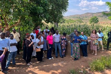 Teams from Uganda and Malawi visiting a community